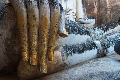 Buddha statue in Wat Si Chum temple located in the North zone of the Sukhothai Historical Park outside the walled city