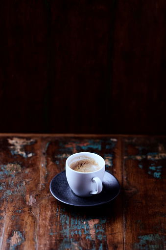 istock Cup of coffee on rustic wooden background. Copy space. 1490240049