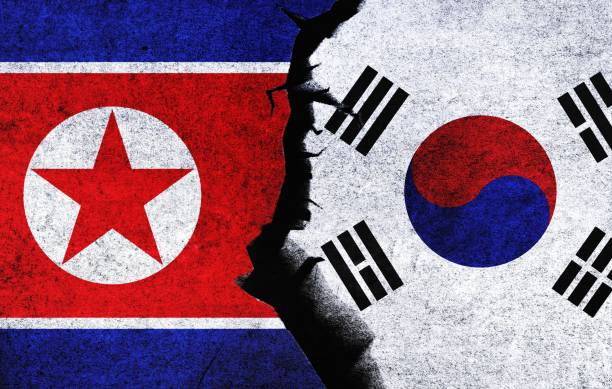 istock North Korea vs South Korea concept flags on wall with crack. 1490242751