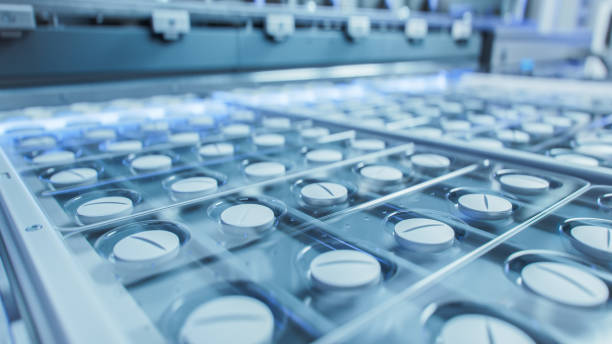 istock Macro Shot of White Pills During Production and Packing Process on Modern Pharmaceutical Factory. Medical Drug Manufacturing. 1490244790