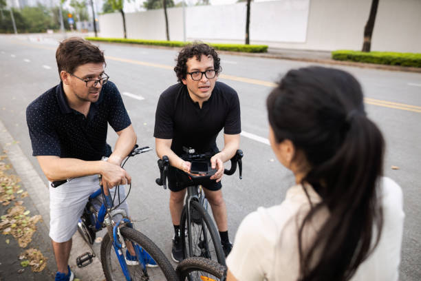 istock Friends ride bikes in the suburbs 1490249989