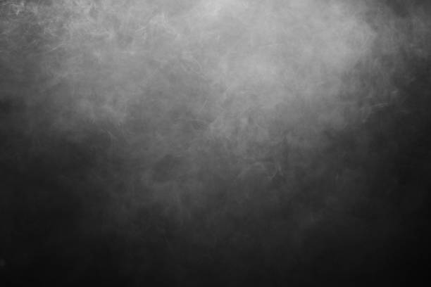 istock Black and white smoke background against black background 1490253588