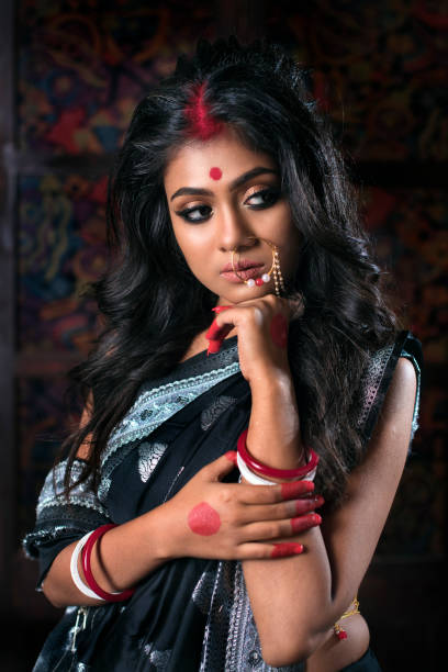 istock Young Indian Women With Bold Expression In Black Saree 1490259992