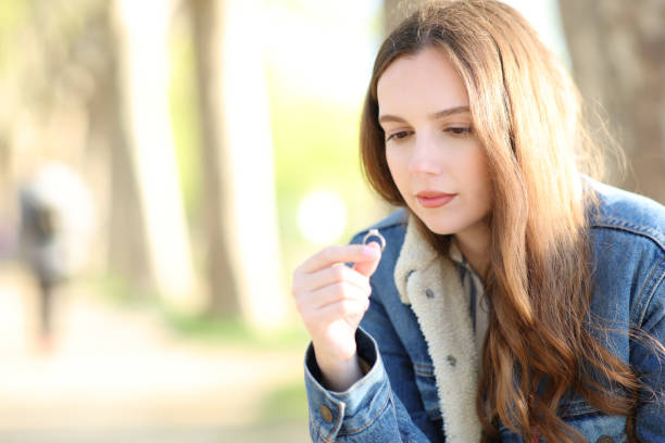 istock Worried fiancee looking at her engagement ring 1490263712