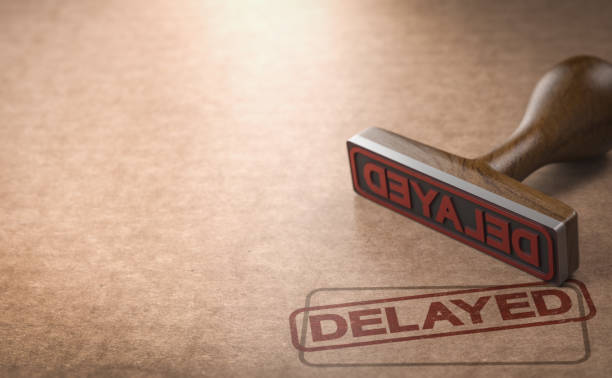 Delayed project or product Rubber stamp over cardboard background with the word delayed stamped on it. 3d illustration waiting stock pictures, royalty-free photos & images