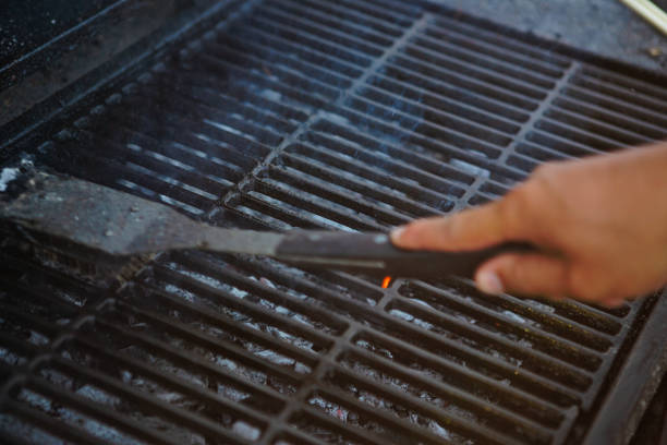 Hand cleaning bbq grill