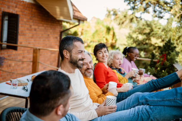 istock Friends sitting outside on a porch 1490265851