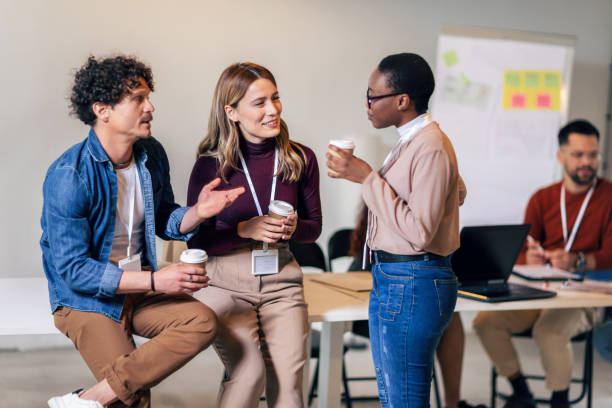 istock Happy diverse colleagues have fun at lunch break in office, smiling multiracial employees laugh and talk  drinking coffee 1490267449