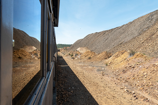 Waste dump in abandoned mines in Souther Spain, seen from a tourist train in the mining theme park