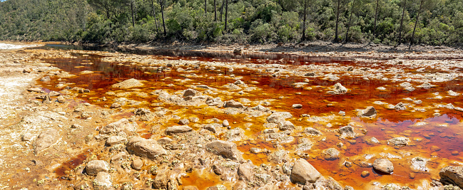 Rio Tinto, Spanish for red river, running through a mining area in Andalucia, receiving its rusty color from natural high iron content of the underground