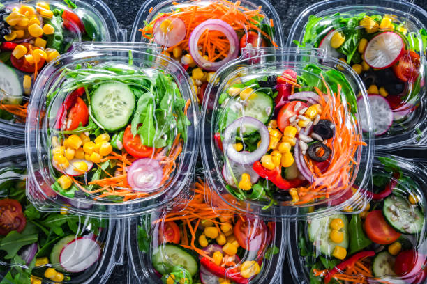 istock Boxes with pre-packaged vegetable salads in a commercial fridge 1490267696