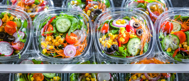 istock Boxes with pre-packaged vegetable salads in a commercial fridge 1490267715