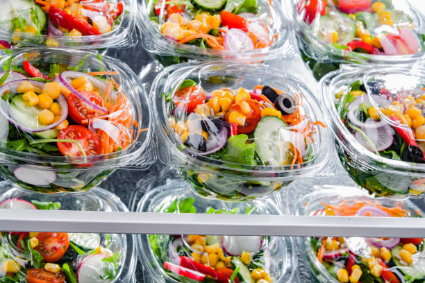 istock Boxes with pre-packaged vegetable salads in a commercial fridge 1490267742