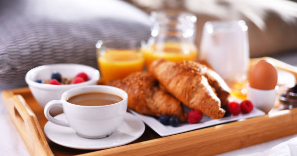 istock A tray with breakfast on a bed in a hotel room 1490267901