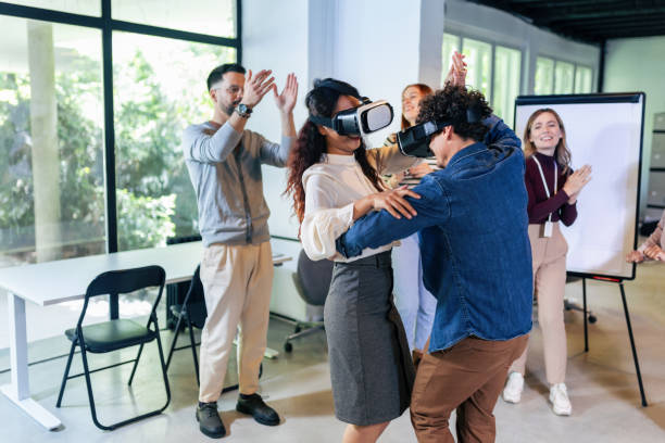 istock Business people making team training exercise during team building seminar using VR glasses 1490268165