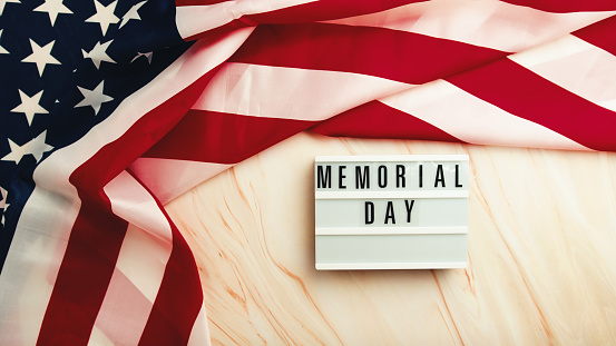 Memorial day background with united states flag on the table.