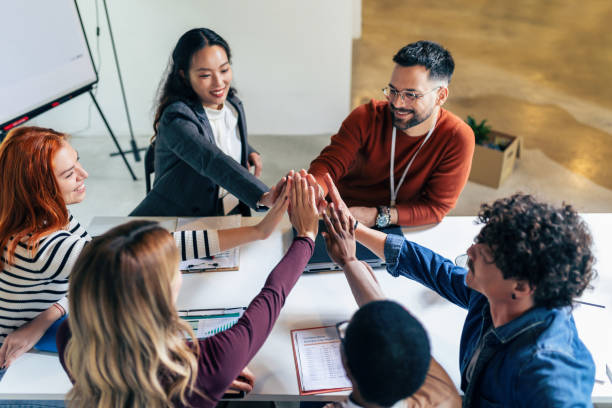istock Business team showing unity with their hands together. 1490269222