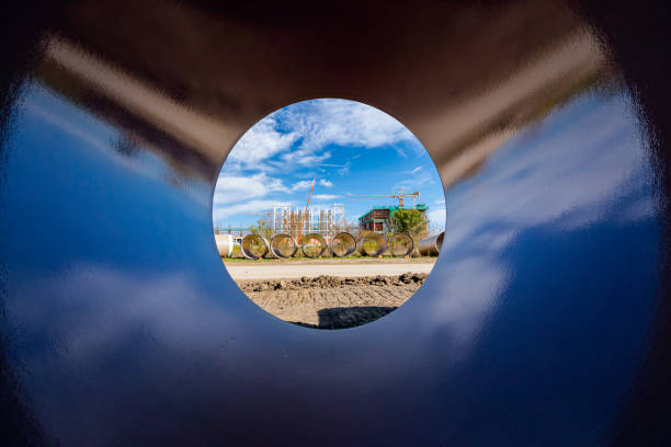 istock Look through stone pipes with resistant glaze placed on the ground in front construction site 1490274765