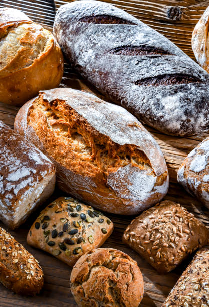 istock Assorted bakery products including loaves of bread and rolls 1490277247
