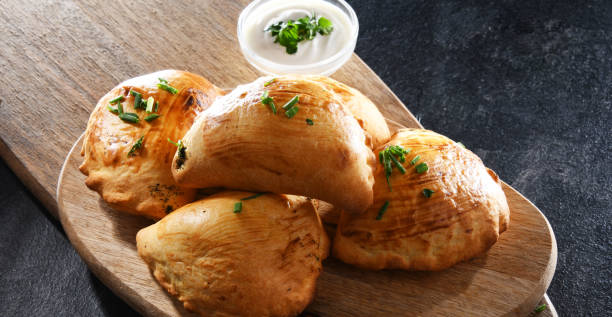 istock Composition with a dish of oven-baked pierogi 1490280720