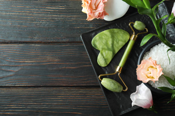 istock Skin care concept with face roller on wooden table 1490280858