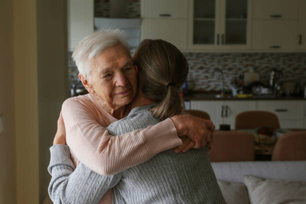 istock Grandmother and granddaughter hugging. 1490281259