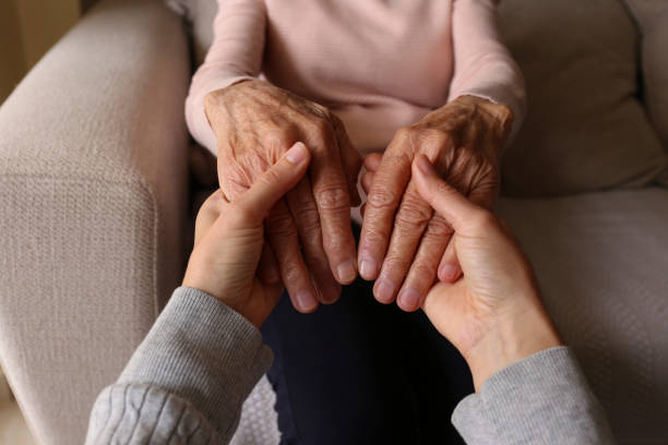 istock Older age mother and her daughter holding hands. 1490281325