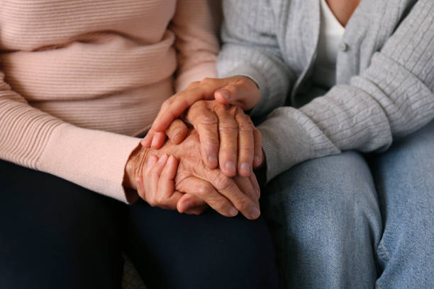 istock Older age mother and her daughter holding hands. 1490282029