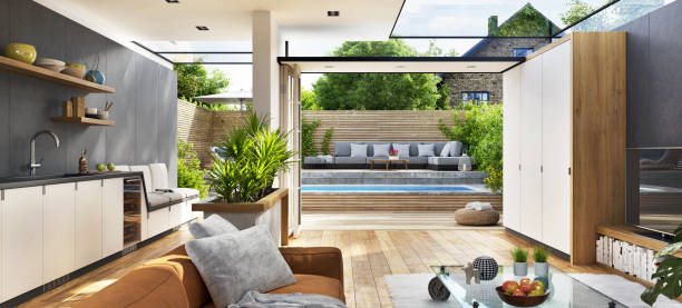 Interior view of a modern sun room with backyard landscape.
