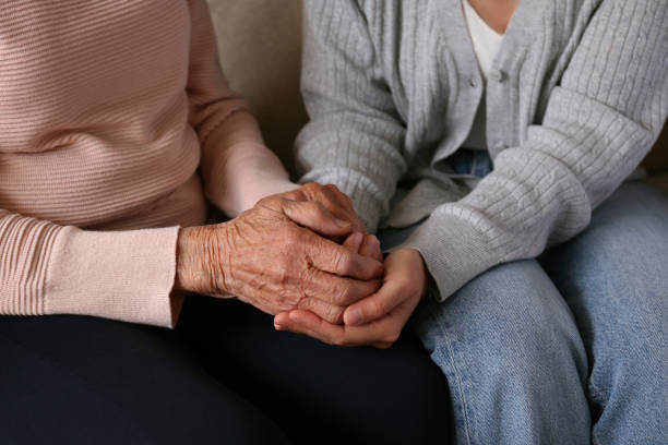istock Older age mother and her daughter holding hands. 1490282293