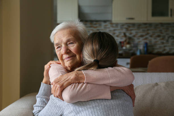 istock Grandmother and granddaughter hugging. 1490282298