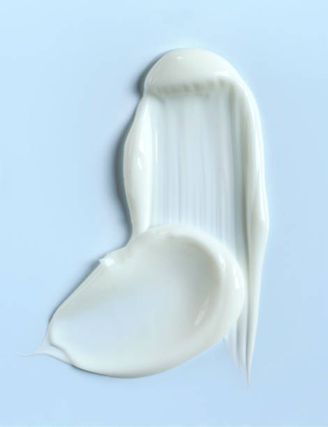 istock cosmetic smears cream texture on pastel blue background 1490283086