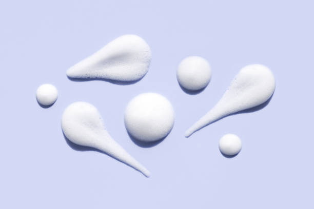 texture foam mousse foam cosmetic smear sample on pastel purple background