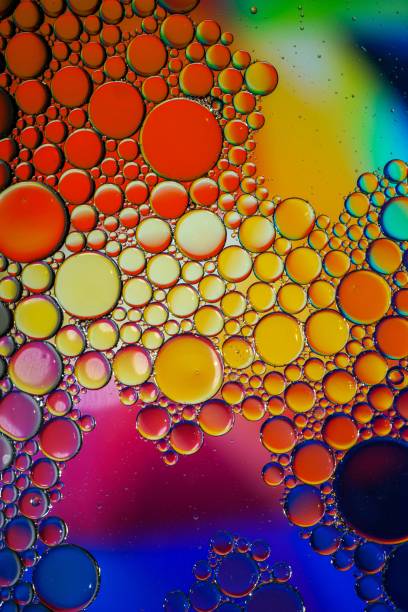istock multi colored oil circles on the water, colorful background 1490284874