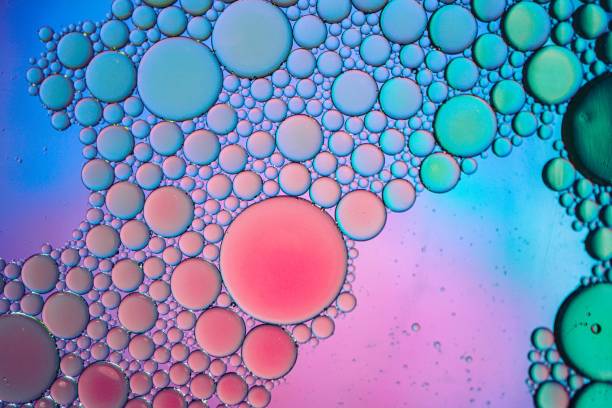 istock multi colored oil circles on the water, colorful background 1490284888