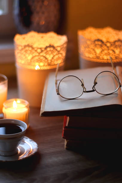 istock Books, Glasses, E-Reader, Pen, Tea, Cookies and Candles 1490288553