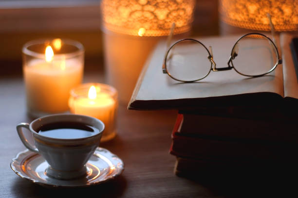 istock Books, Glasses, E-Reader, Pen, Tea, Cookies and Candles 1490288557