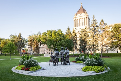 Winnipeg, Canada – August 31, 2022: An image of the Manitoba Legislative Building in Winnipeg, Canada, featuring a memorial to Nellie McClung and her role in women's suffrage