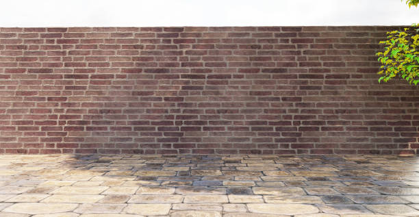 istock Brick wall stone wall stone floor gravel floor backdrop background sunlight and tree shadow 3D rendering 1490290341