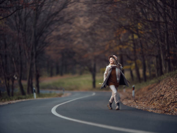 Happiness and freedom with beautiful people enjoying the outdoor leisure activity in scenic place - concept of travel and tourism holiday vacation - happy woman opening arms and smile