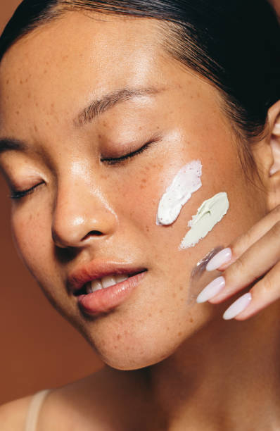 istock Facial skincare with exfoliating cream 1490291524