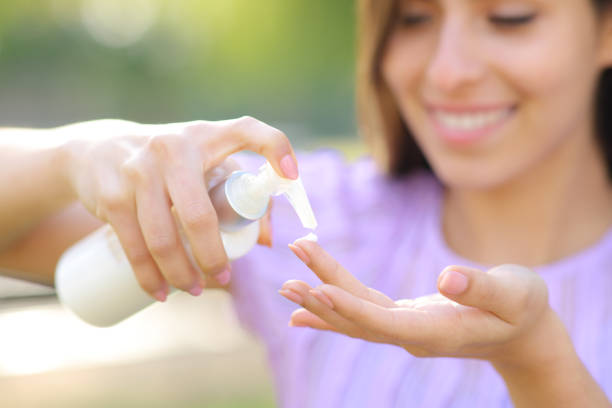 istock Happy woman applying hydration cream on finger 1490293101