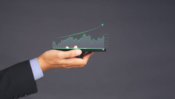 istock Digital increasing bar business graph growth on the palm with a gray background. 1490293302