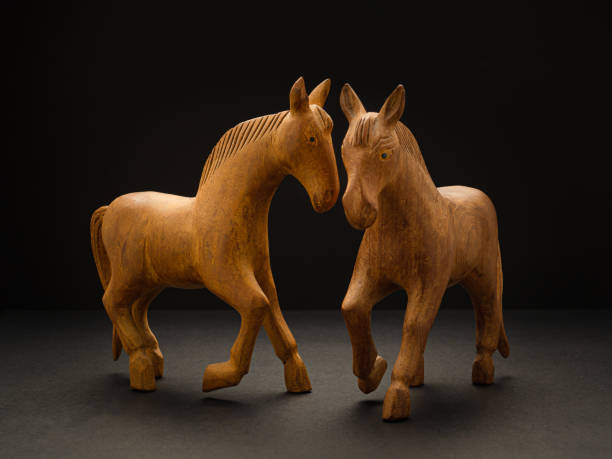 istock Old wooden horses over on the black background 1490294794