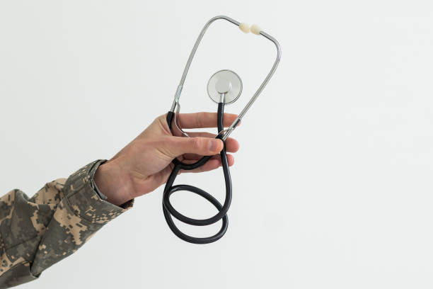 istock Young man army soldier holding stethoscope. 1490296727