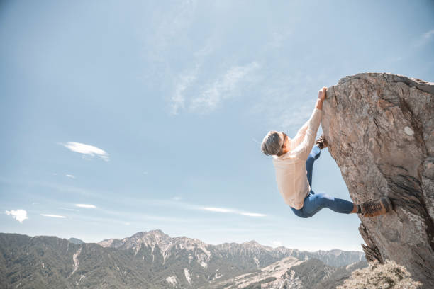 Hiker on the top of the mountain peak.