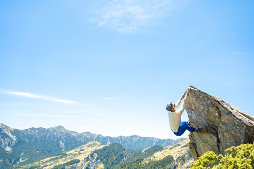 Hiker on the top of the mountain peak.