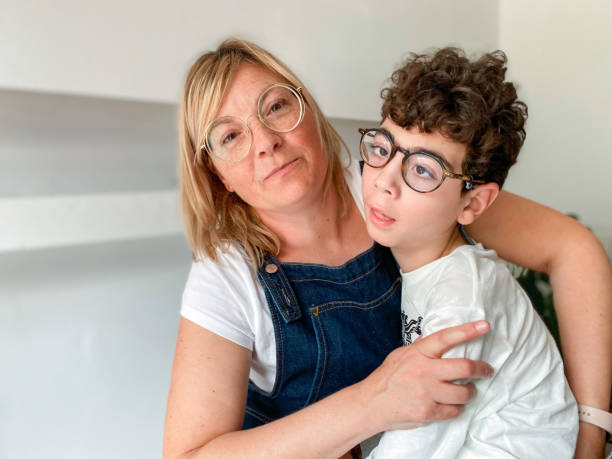 istock Loving mother with disabled son sitting on top 1490298460