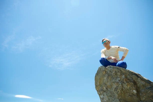 Hiker on the top of the mountain peak.