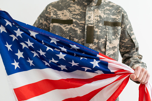 Soldier military man holding usa flag